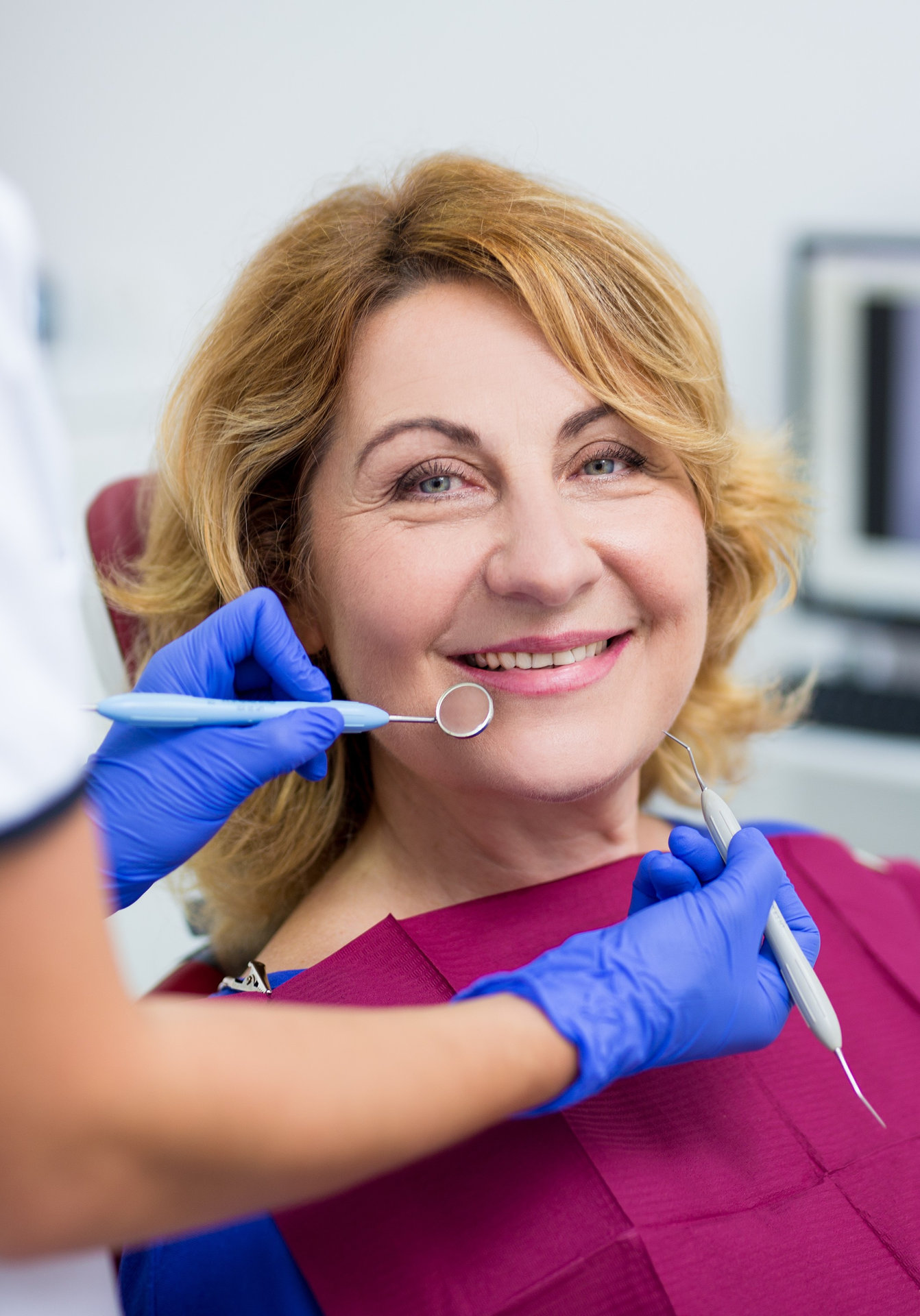 portrait of mature woman patient in dental clinic